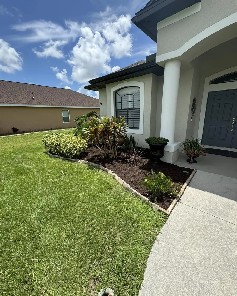 Front entry landscaping with new plants and mulch